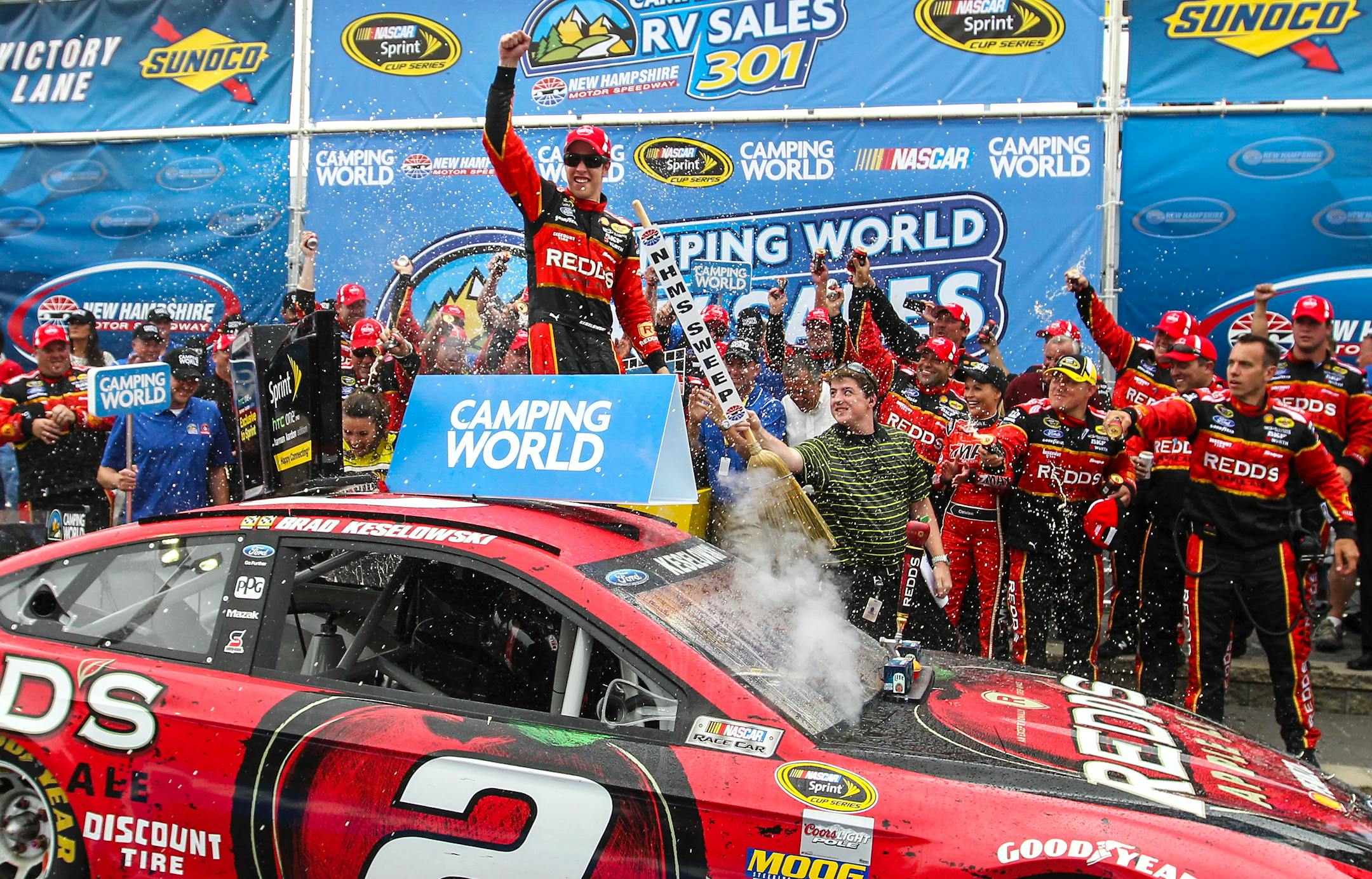 Brad Keselowski celebrates in Victory Lane after winning the NASCAR Sprint Cup Series auto race at New Hampshire Motor Speedway on Sunday, July 13, 2014, in Loudon, N.H. (AP Photo/Cheryl Senter)