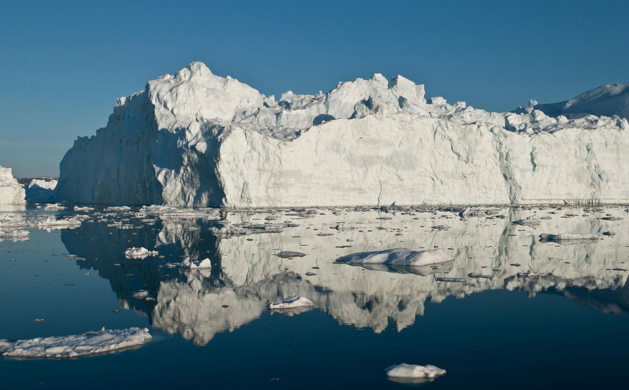 This May 30, 2012 image provided by Ian Joughin shows an iceberg in or just outside the Ilulissat fjord, that likely calved from Jakobshavn Isbrae, the fastest glacier in west Greenland. Polar ice sheets are now melting three times faster than in the 1990s, but so far that's added just less than half an inch to already rising global sea levels, a new giant scientific study says. While the amount of sea level rise isn't as bad as some earlier worst case scenarios, the acceleration of the melting,