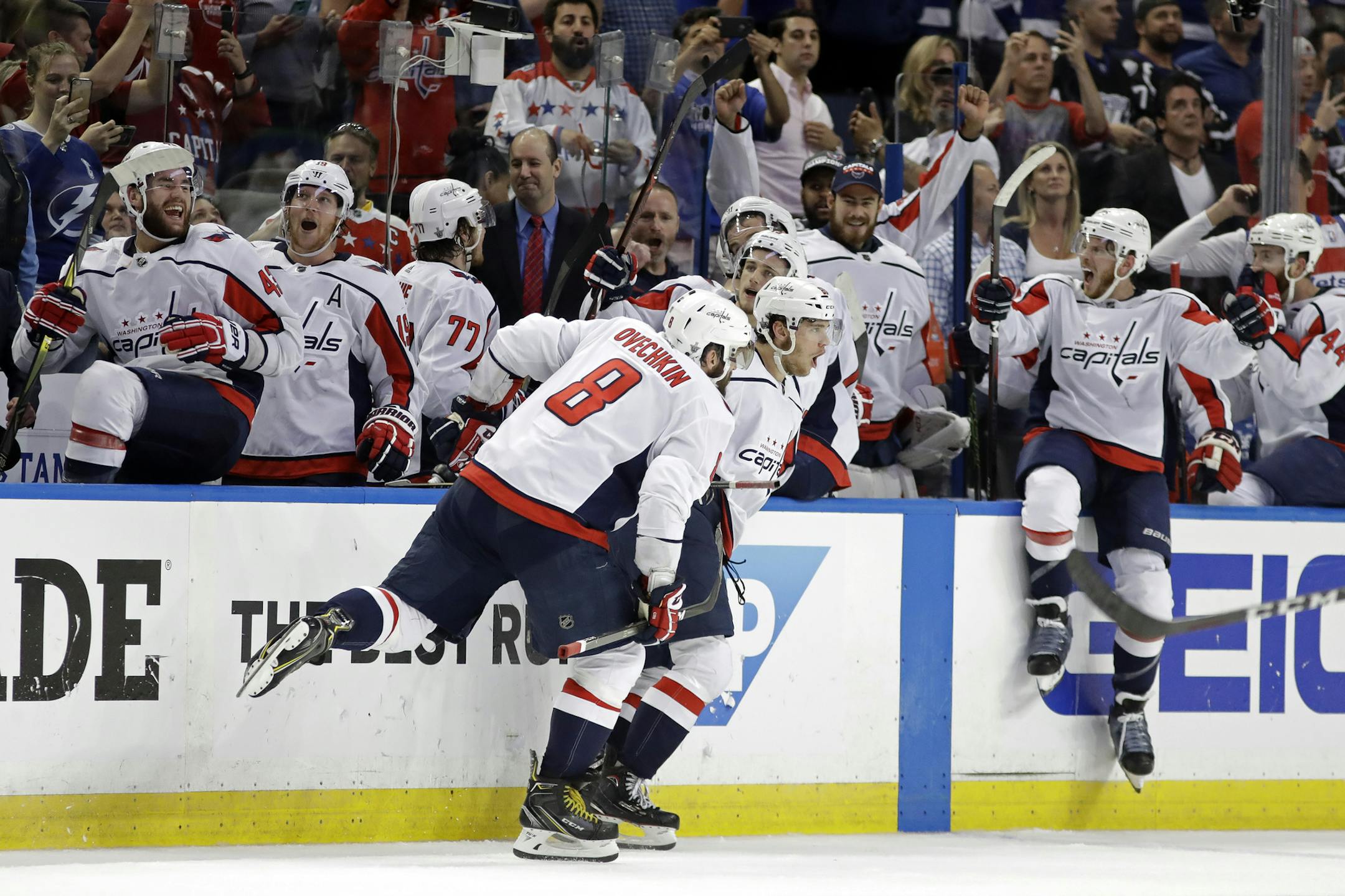 Washington Capitals, including left wing Alex Ovechkin (8). celebrate after defeating the Tampa Bay Lightning in Game 7 of the NHL Eastern Conference finals hockey playoff series Wednesday, May 23, 2018, in Tampa, Fla. (AP Photo/Chris O'Meara)