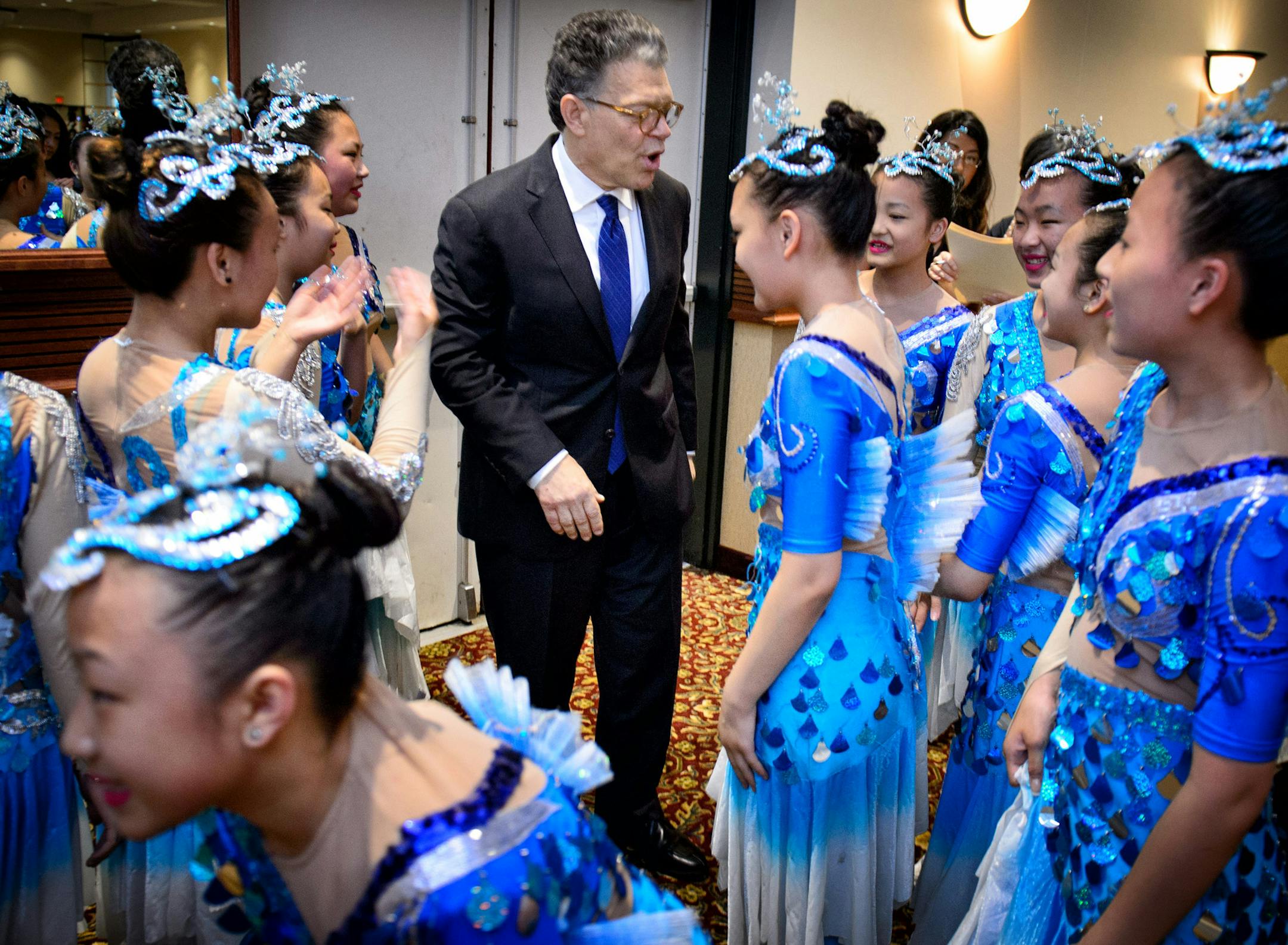 The Senator Al Franken posed for photos and thanked members of the Iny Asian Dance Theater who performed the "Happy Fish Dance" while he attended the Hmong Freedom banquet. Saturday, June 28, 2014. ] GLEN STUBBE * gstubbe@startribune.com