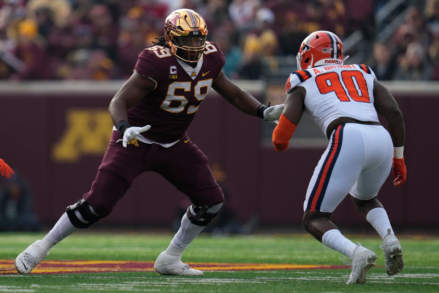 Minnesota offensive lineman Aireontae Ersery (69) blocks against Illinois linebacker Alec Bryant (90) during the first half of an NCAA college football game Saturday, Nov. 4, 2023, in Minneapolis. (AP Photo/Abbie Parr)