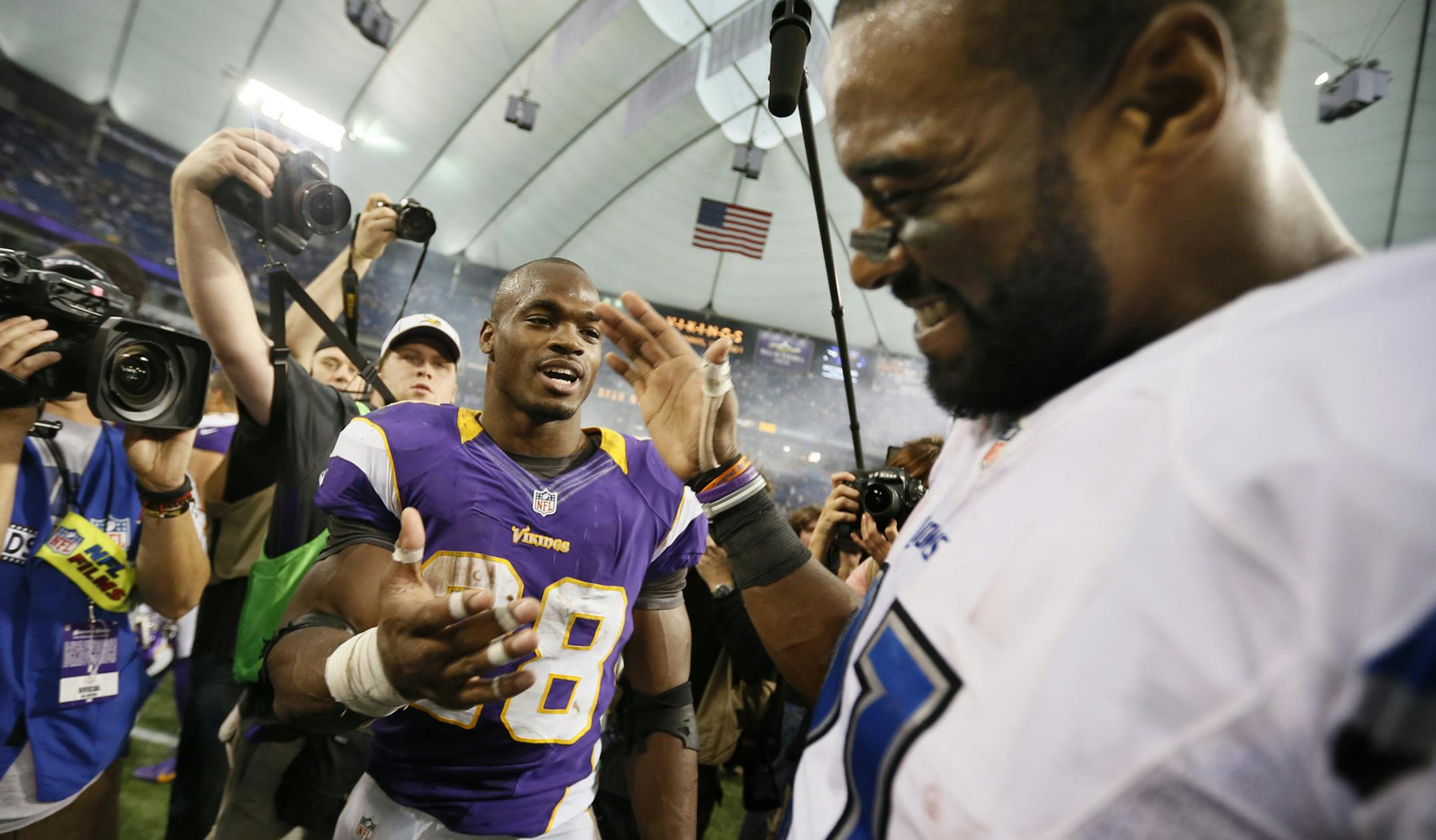 Adrian Peterson (28) left shook hands with Detroit Lions wide receiver Calvin Johnson (81) after the Vikings beat Detroit 34-245 Sunday Nov.11,2012 at Mall of the America Field in Minneapolis, MN.] JERRY HOLT ‚Ä¢ jerry.holt@startribune.com ORG XMIT: MIN1211111550249433