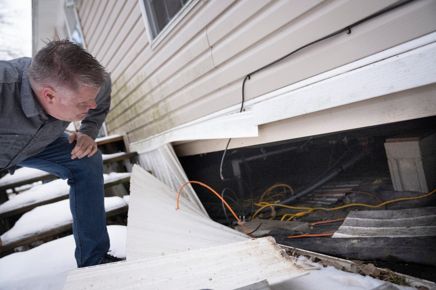 Dean Swenson showed the piping under a home in the Viking Terrace Mobile Home Park he and several other community members helped winterize with heat tape at a mobile home that was updated as part of the effort by the Healthy Community Initiative to update more than 30 mobile homes in Northfield and Faribault on Wednesday, March 2, 2022. An entire community joined together to offer essential updates to mobile homes so that residents could enjoy safe heat and running water.