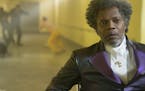 Samuel L. Jackson as Elijah Price/Mr. Glass and James McAvoy (background, in yellow) as Kevin Wendell Crumb/The Horde in "Glass," written and directed