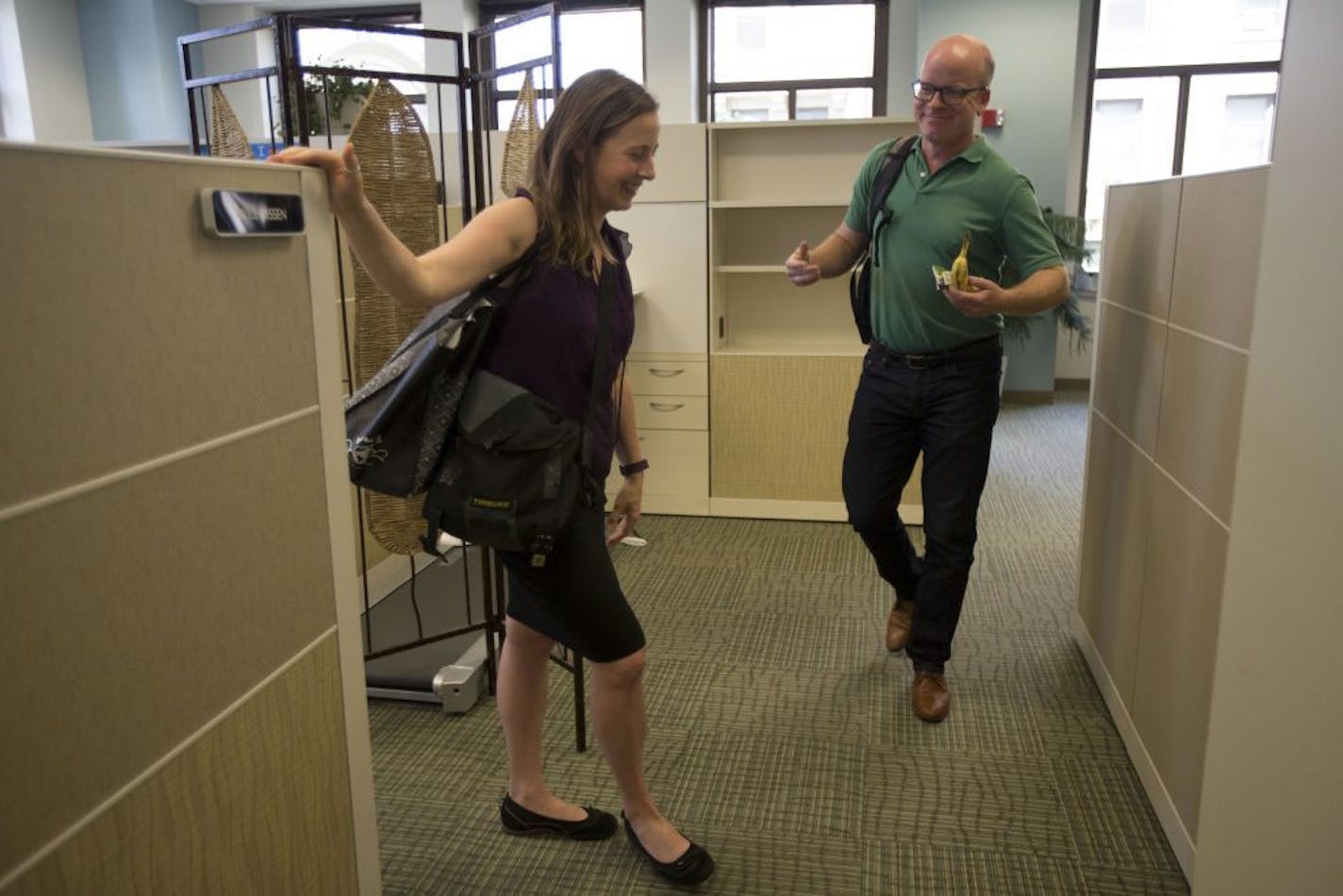 Ellen Palmer waits for her colleague, Rob Davis, to leave work with on Friday at noon.