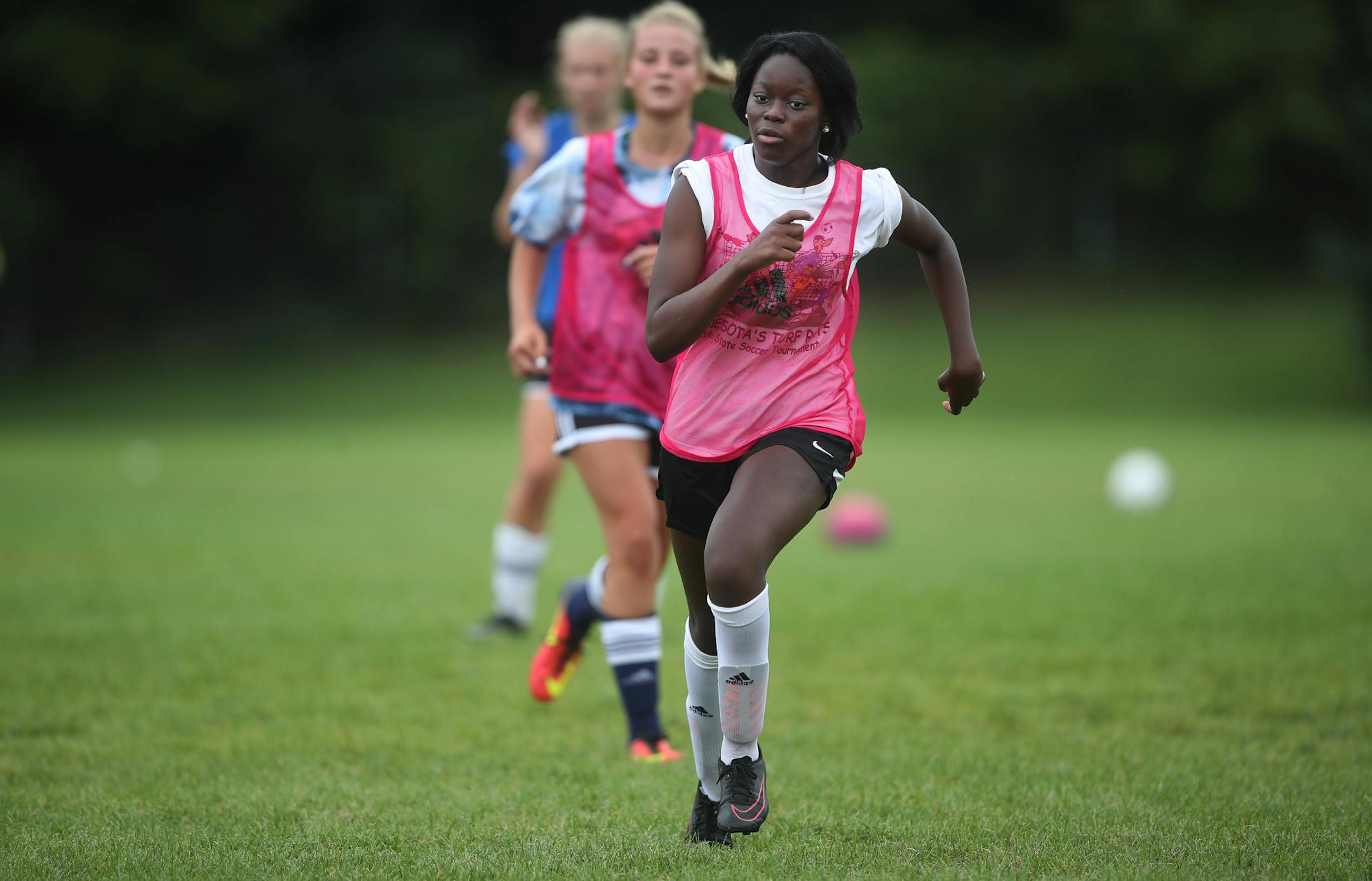 Andover's Rebecka Musungu, a senior forward, led teammates in a drill last week. "We have high expectations for ourselves," she said.
