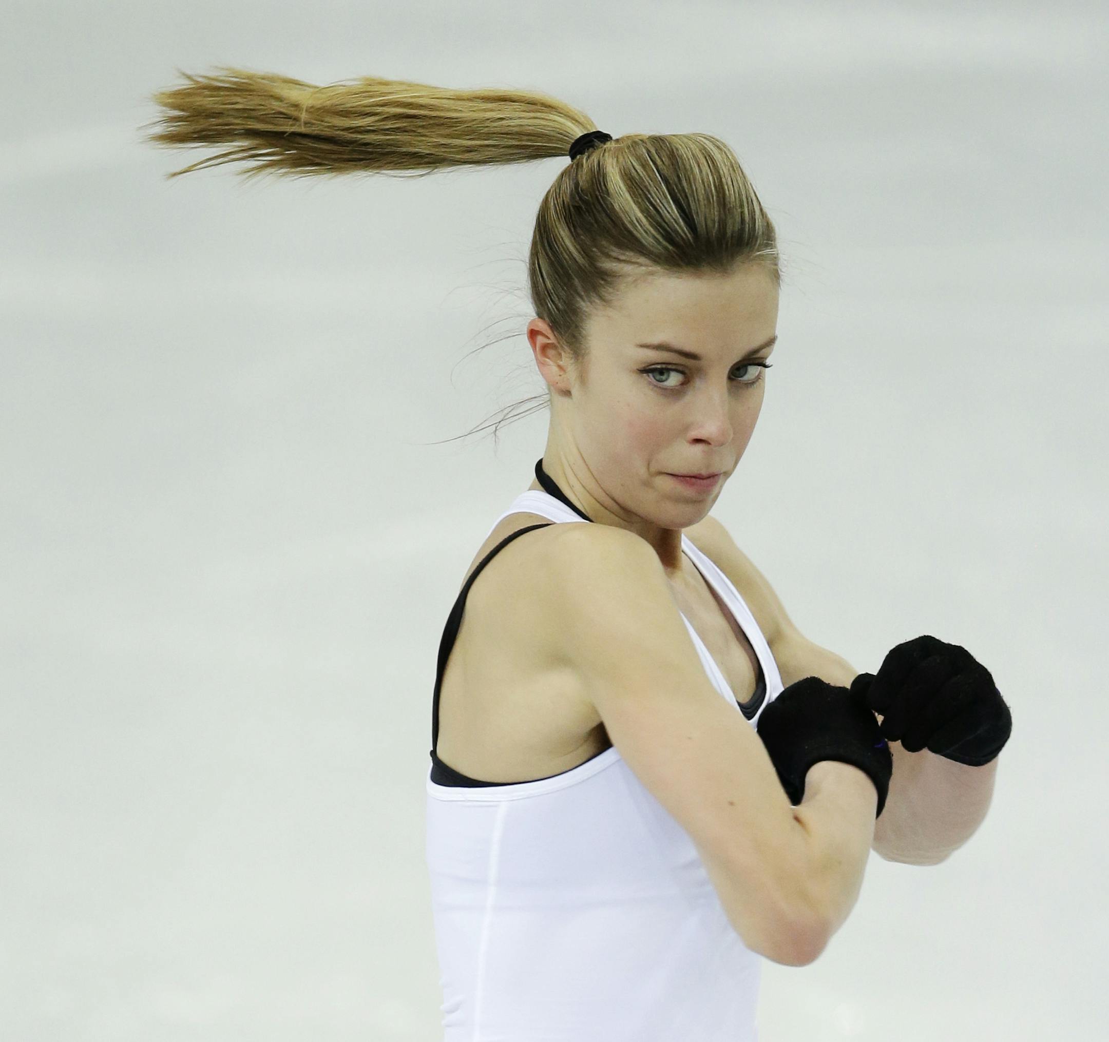 Ashley Wagner of the United States skates during a practice session at the figure stating practice rink at the 2014 Winter Olympics, Monday, Feb. 17, 2014, in Sochi, Russia. (AP Photo/Darron Cummings)