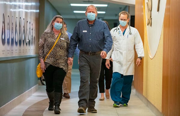 Bob Schlicht, his wife Kristine Smoley, and Dr. Tim Rich, M.D. walked down the hall to meet the only other person in the world to receive the same exp