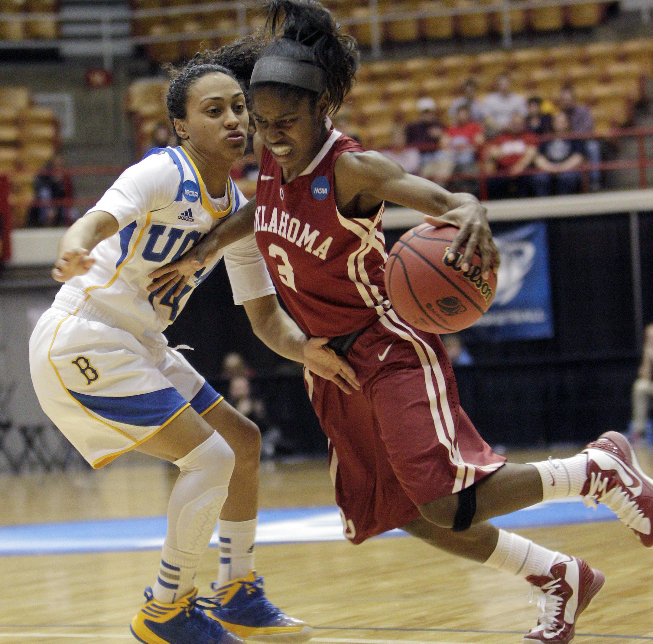 Oklahoma's Aaryn Ellenberg, right, brings the ball up court as UCLA's Mariah Williams defends during the second half of a second-round game in the women's NCAA college basketball tournament Monday, March 25, 2013, in Columbus, Ohio. Oklahoma beat UCLA 85-72. (AP Photo/Jay LaPrete)