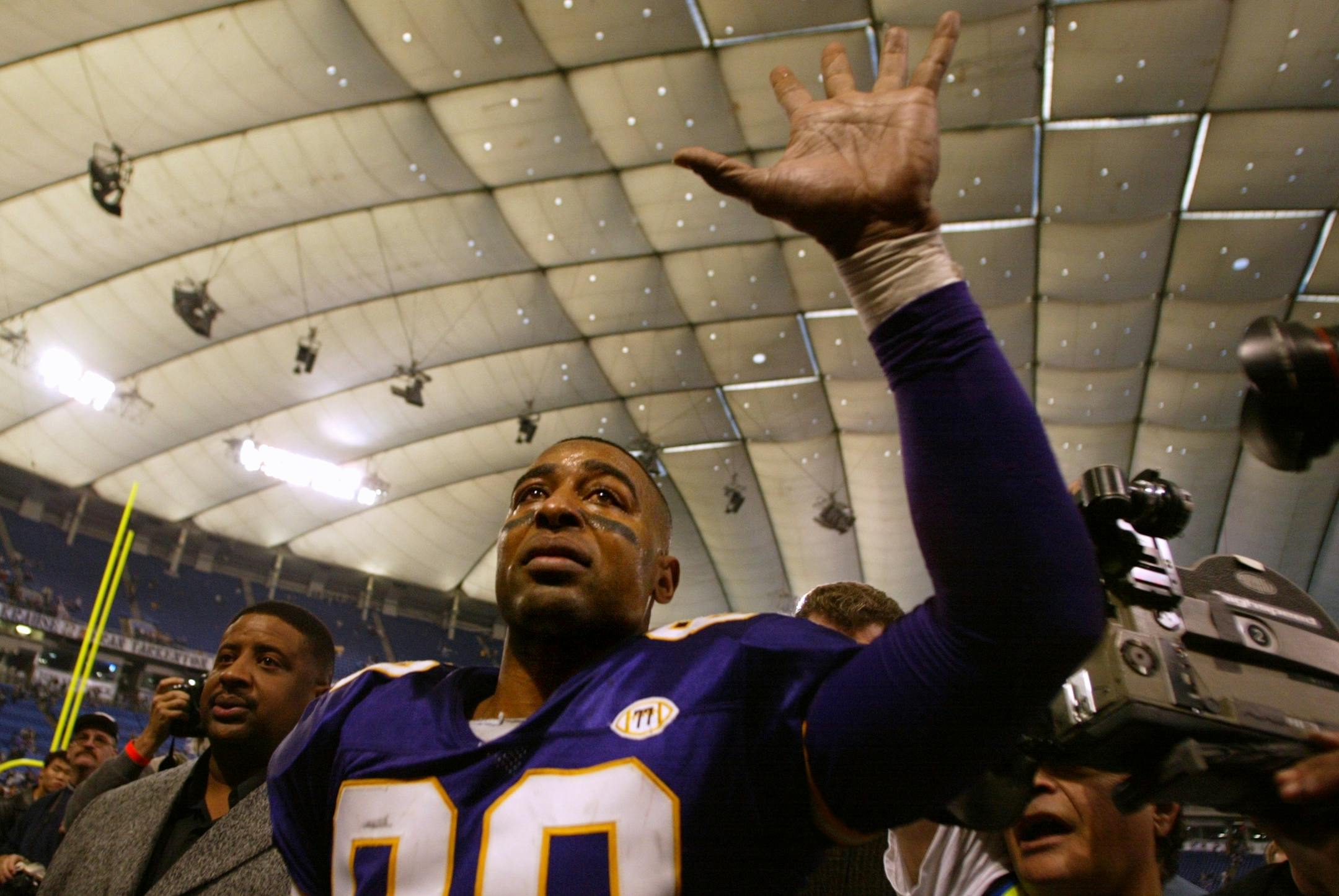Vikings receiver Cris Carter, #80, waves to the fans as he walks off the field after Sunday's game. The Jacksonville Jaguars beat the Minnesota Vikings by a final score of 33-3 on Sunday in the Metrodome in Minneapolis, MN.