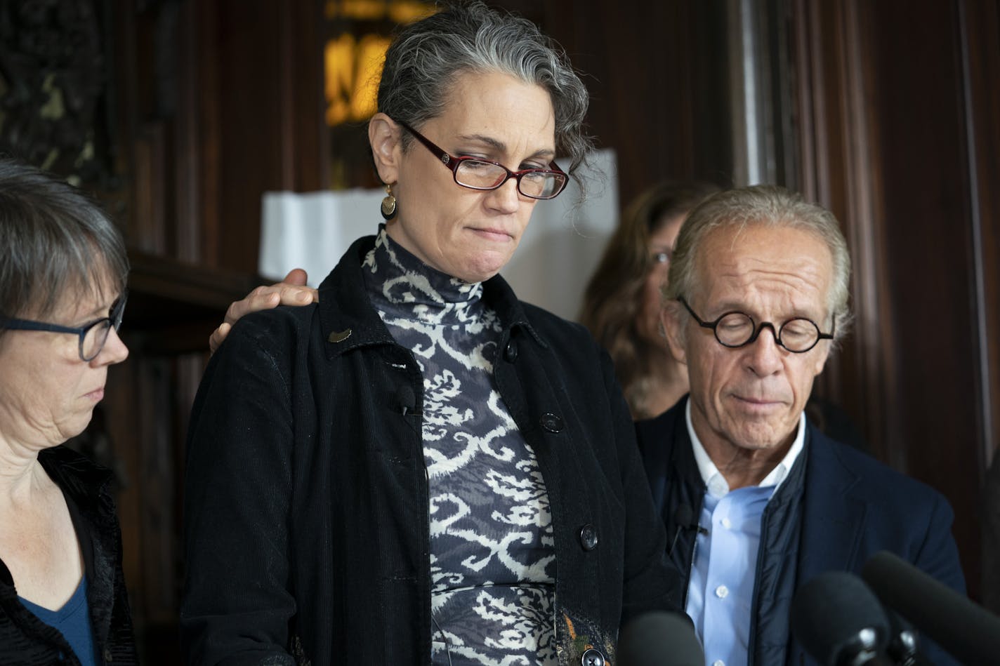 Laura Stearns read a statement at a press conference at attorney Jeff Anderson's, at right, office after a Minneapolis jury found the Children's Theatre negligent in the sexual abuse of Stearns in the 1980s but did not award damages. The jury also found former Children's Theatre employee and restaurateur Jason McLean liable in the sexual and awarded his victim, Stearns, $3.68 million. Photographed in St. Paul, Minn., on Friday, February 1, 2019. ] RENEE JONES SCHNEIDER &#xa5; renee.jones@startri