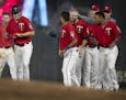 Twins players celebrated Minnesota Twins right fielder Max Kepler (26) single in the 17 inning scoring Luis Aaraez for the win at Target Field early W