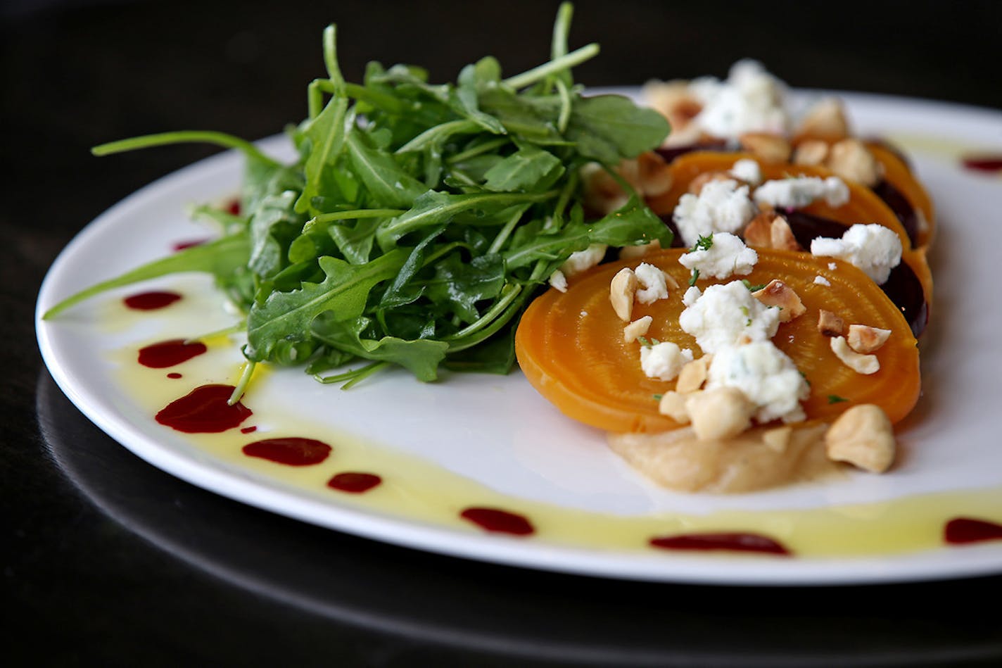 Beet roasted salad and marinated beets, brown butter vinaigrette, toasted hazelnuts, wild arugula, and truffled local goat cheese at Vivo, Monday, February 16, 2015 in Apple Valley, MN. ] (ELIZABETH FLORES/STAR TRIBUNE) ELIZABETH FLORES &#xa5; eflores@startribune.com