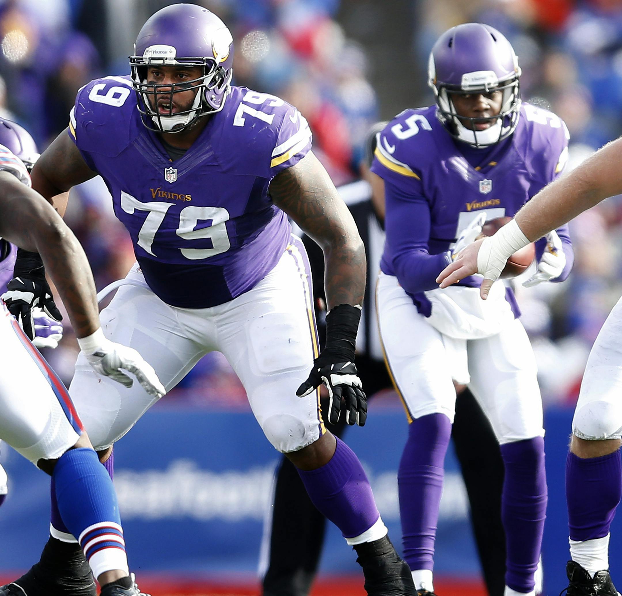 Minnesota Vikings offensive lineman Mike Harris (79) and center Joe Berger (61) play during the third quarter of their game against the Buffalo Bills on Sunday, Oct. 19, 2014, at Ralph Wilson Stadium in Orchard Park, N.Y. (Carlos Gonzalez/Minneapolis Star Tribune/MCT) ORG XMIT: 1158870