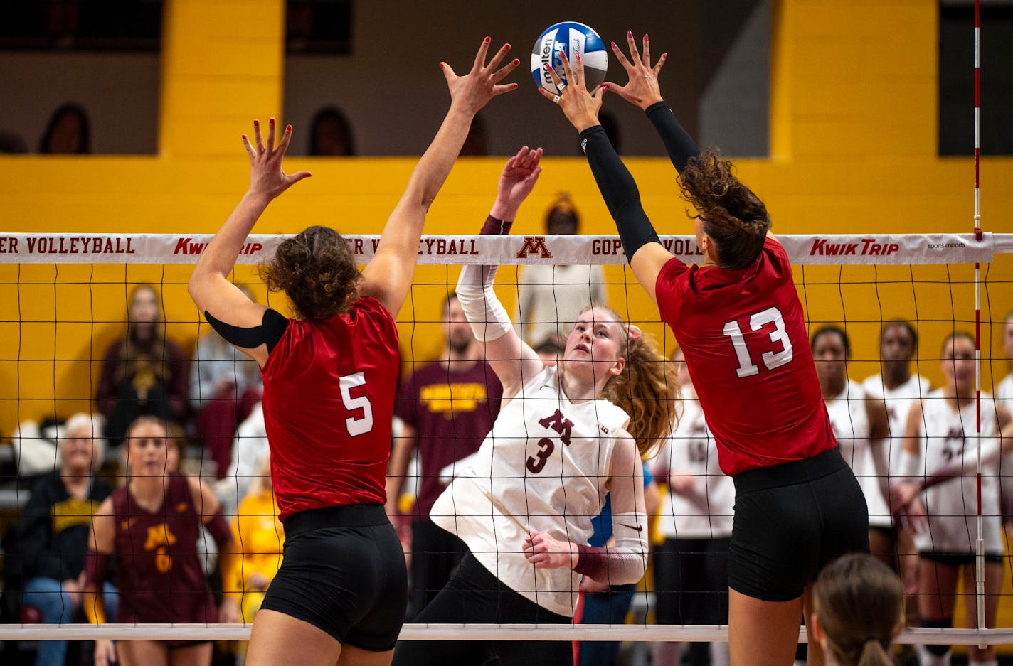 Nebraska players blocked Gophers outside Mckenna Wucherer's kill attempt Saturday.