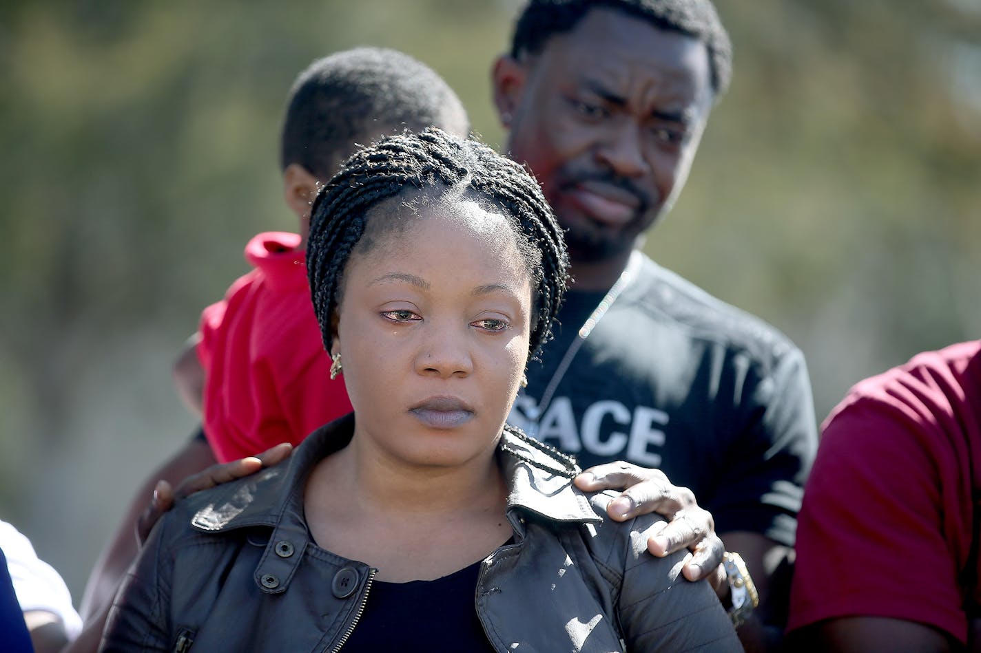 Yamah Collins is comforted by her family members as Pastor Harding Smith made a statement regarding formal charges against her husband Pierre Collins, Tuesday, April 14, 2015 in Crystal.