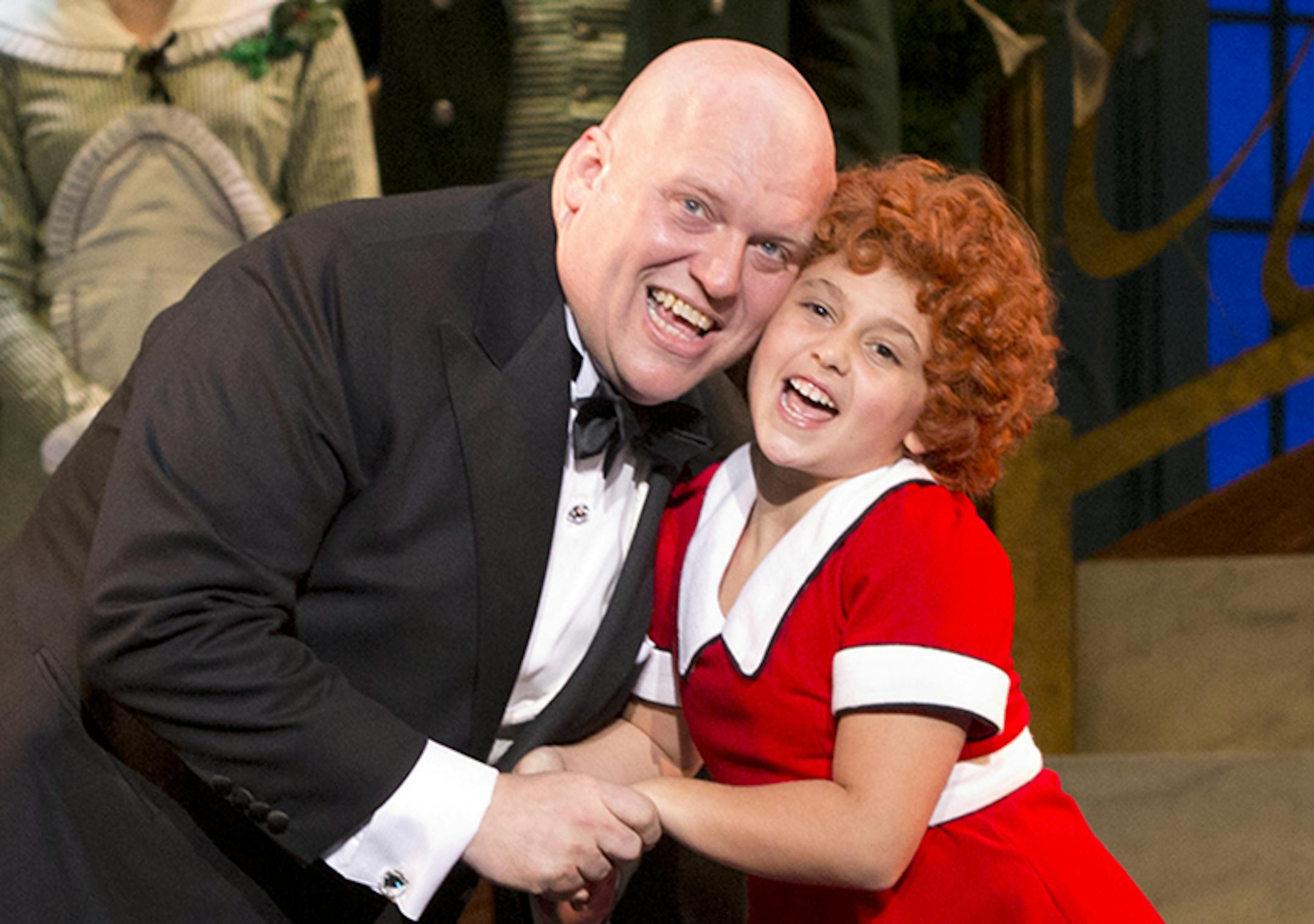 Gilgamesh Taggett as Oliver Warbucks and Issie Swickle as Annie in "Annie" at the Orpheum Photo credit: Photo by Joan Marcus