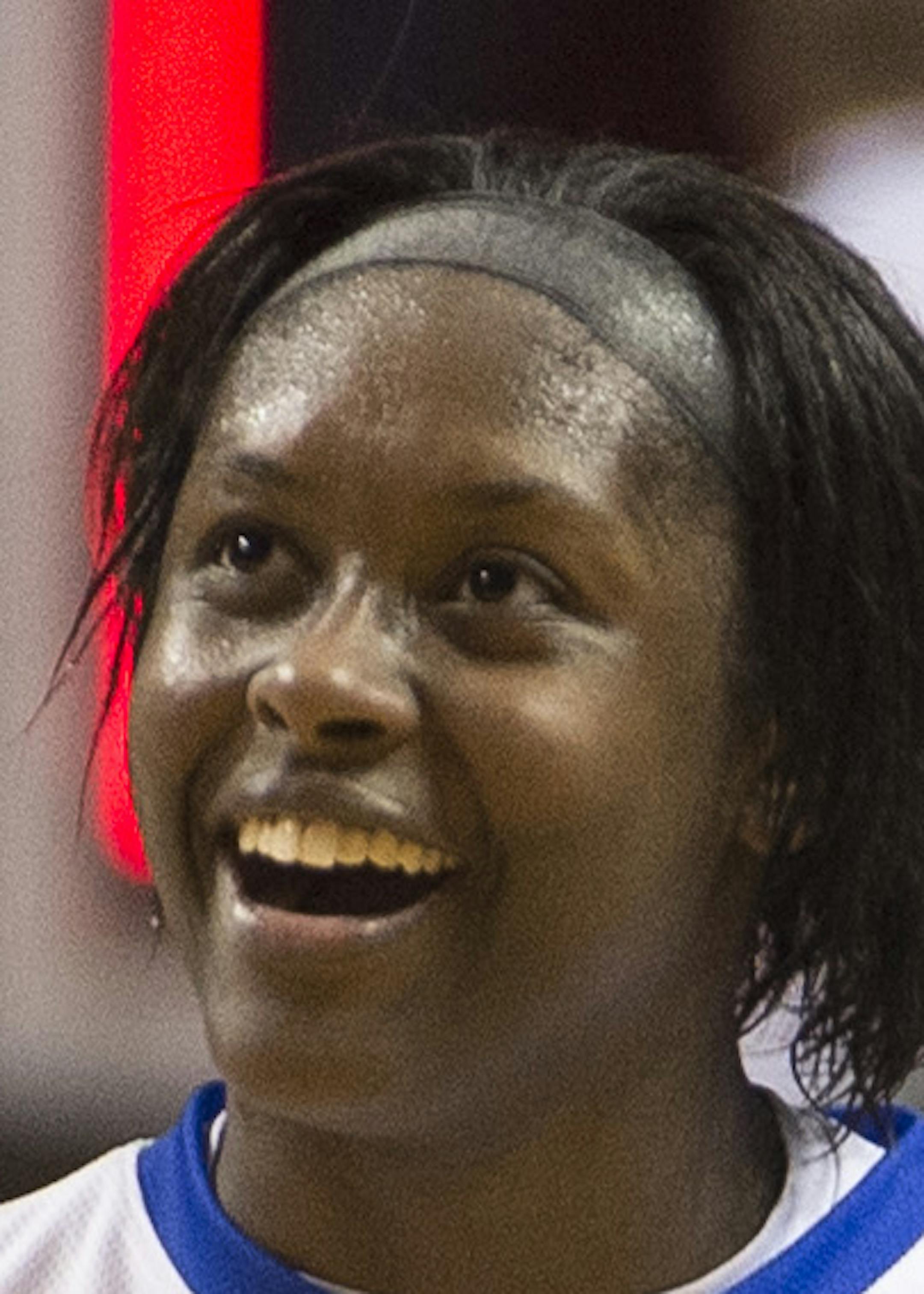 Hopkins guard Nia Hollie (12) celebrates her team's 68-60 victory over Eastview in the Class 4A girls' championship game on Saturday. ] (Aaron Lavinsky | StarTribune) Eastview plays against Hopkins in the Class 4A girls' basketball championship game on Saturday, March 21, 2015 at Williams Arena. Hopkins defeated Eastview 68-60.