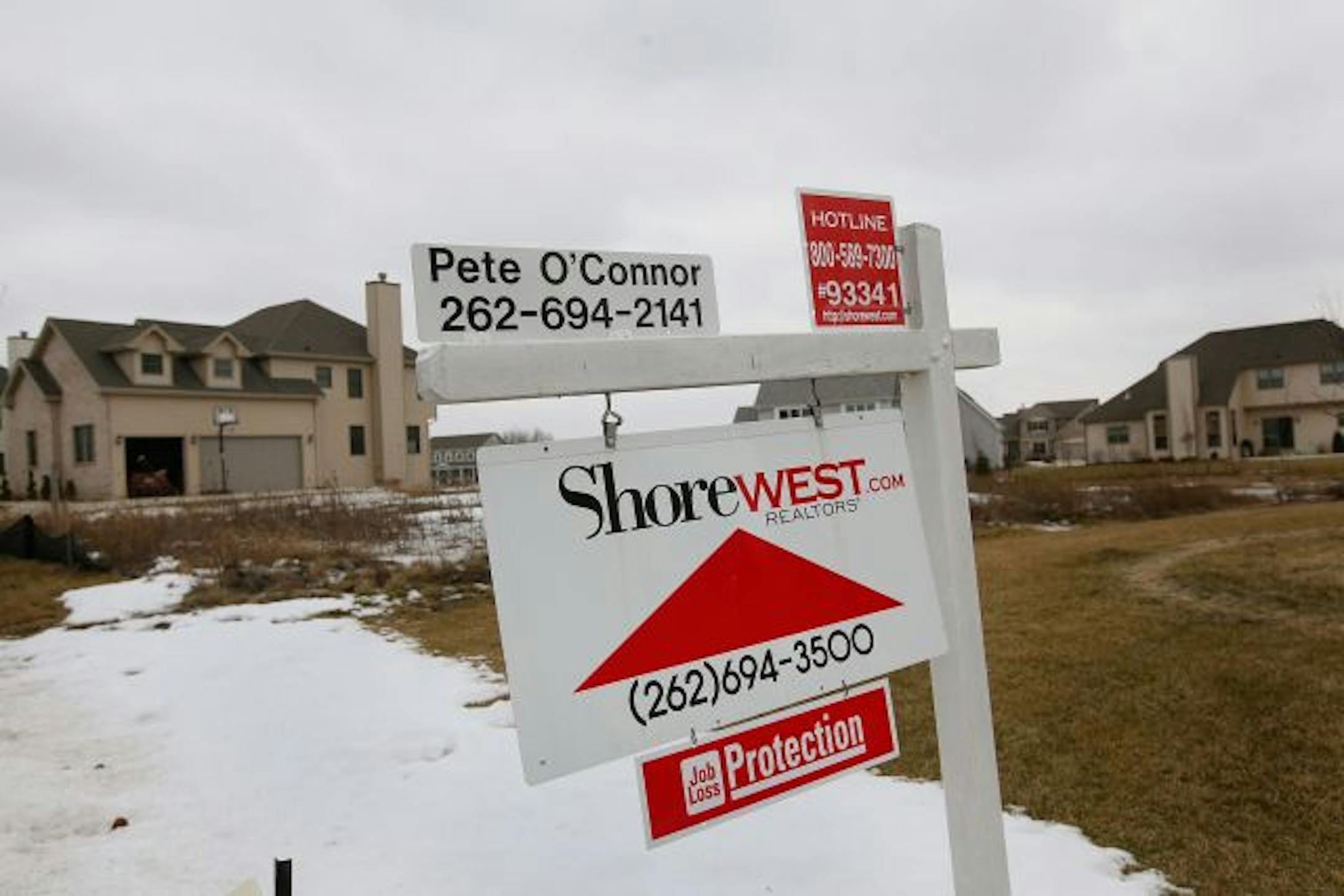 PLEASANT PRAIRIE, WI - JANUARY 25: A sign sits in the front yard of a home being offered for sale January 25, 2010 in Pleasant Prairie, Wisconsin. Sales of previously occupied homes in the U.S. plunged an unexpected 16.7 percent last month, their largest drop in more than 40 years. Over the past year home prices dropped more than 12 percent, the largest decline since the Great Depression.