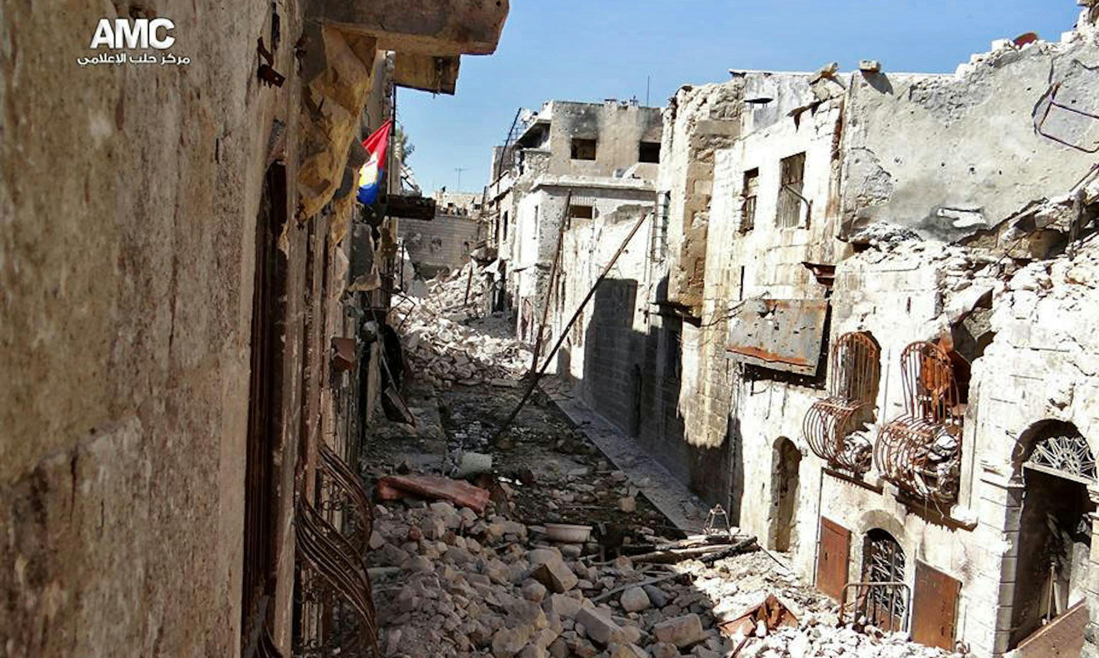 This citizen journalism image provided by Aleppo Media Center AMC which has been authenticated based on its contents and other AP reporting, shows damages due to heavy fighting between government forces and Free Syrian Army fighters in the old city of Aleppo, Syria, Friday, Sept. 13, 2013. (AP Photo/Aleppo Media Center, AMC)