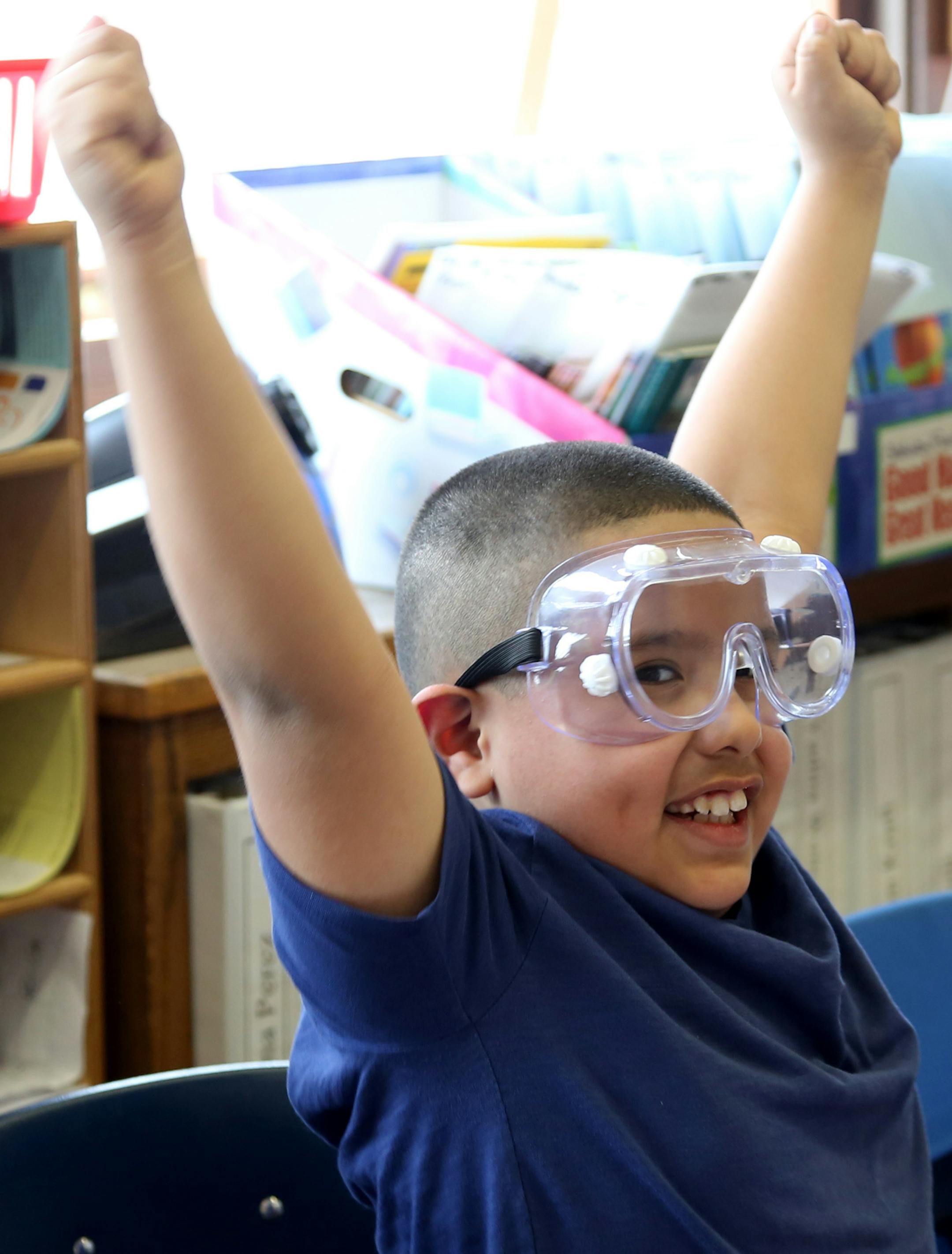 Lenny Rodriguez, 8, celebrated that the light came on as the class worked on a circuit board as a part of a science project.