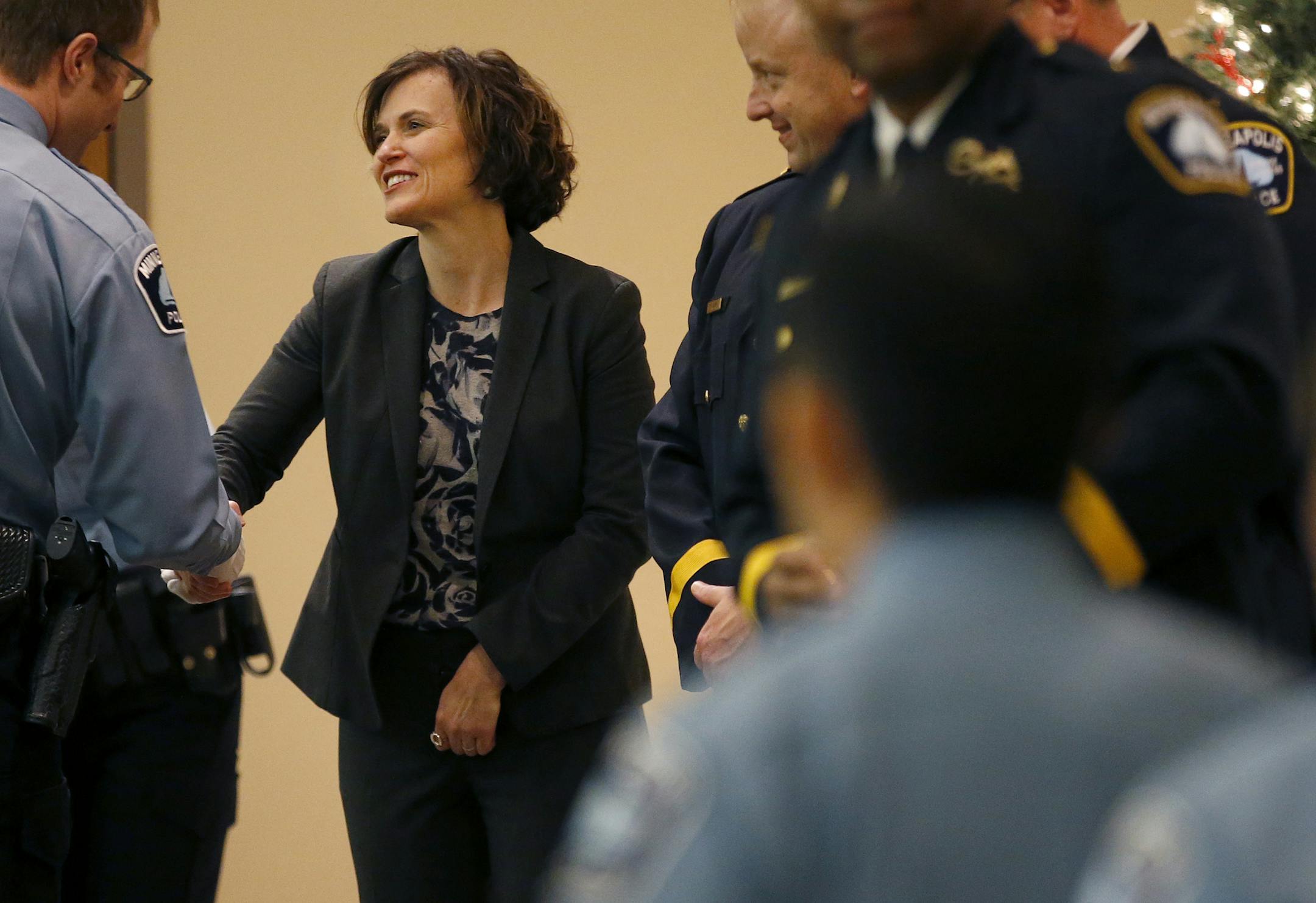Minneapolis Mayor Betsy Hodges shook hands with new officers during the Minneapolis Police officer's graduation ceremony of the 2015 Recruit/Lateral Class at St. Mary's Greek Orthodox Church. ] CARLOS GONZALEZ ï cgonzalez@startribune.com - December 17, 2015, Minneapolis, MN, St. Mary's Greek Orthodox Church, Minneapolis Mayor Betsy Hodges, Hodges attends police graduation ceremony.