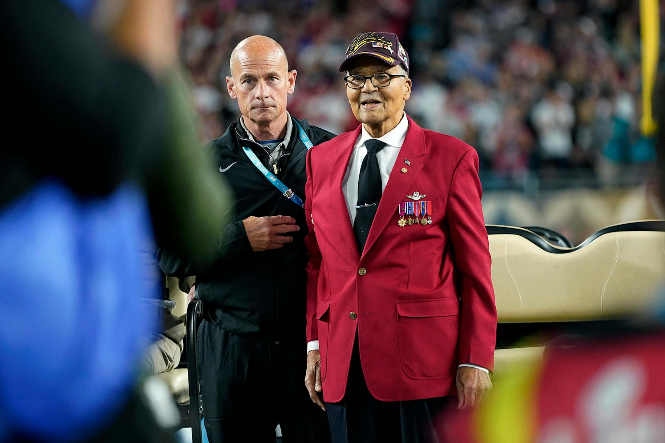 Col. Charles McGee, right, a Tuskegee Airmen during World War II, participates in the coin toss before the NFL Super Bowl 54 football game between the San Francisco 49ers and the Kansas City Chiefs Sunday, Feb. 2, 2020, in Miami Gardens, Fla.