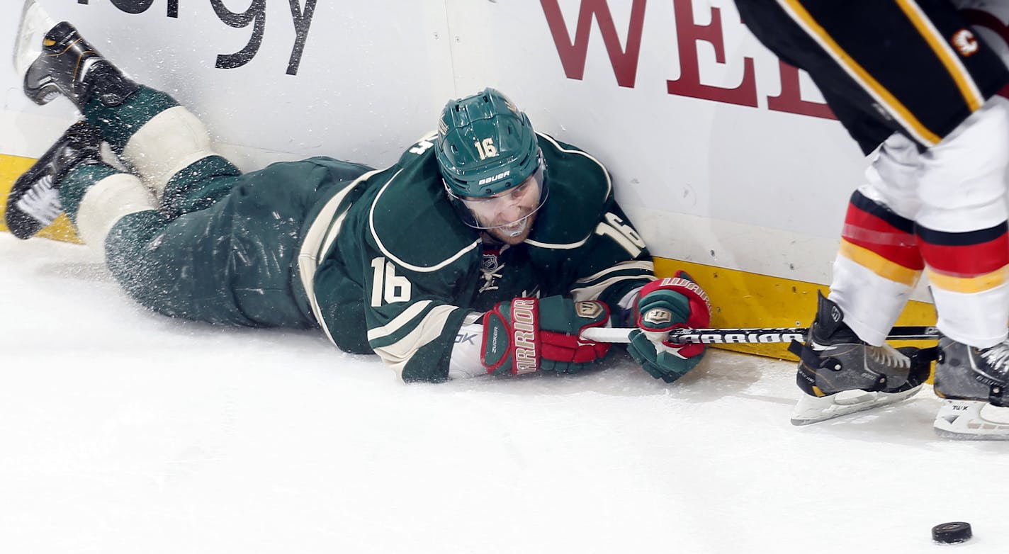 Jason Zucker (16) reached out for the puck in the second period. Calgary beat Minnesota by a final score of 4-1. ] CARLOS GONZALEZ cgonzalez@startribune.com April 21, 2013, St. Paul, Minn., Xcel Energy Center, NHL, Minnesota Wild vs. Calgary Flames