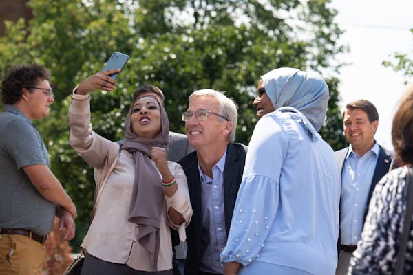 Republican candidate for governor Scott Jensen posed for a selfie with supporters at the opening of a new Minnesota GOP Somali Community Center in Min