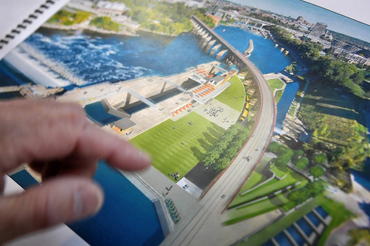 Anfinson points out what he hopes will become an expanded visitors center at Lock and Dam No. 1 in Minneapolis. The conceptual design study was sponsored by Friends of the Lock.