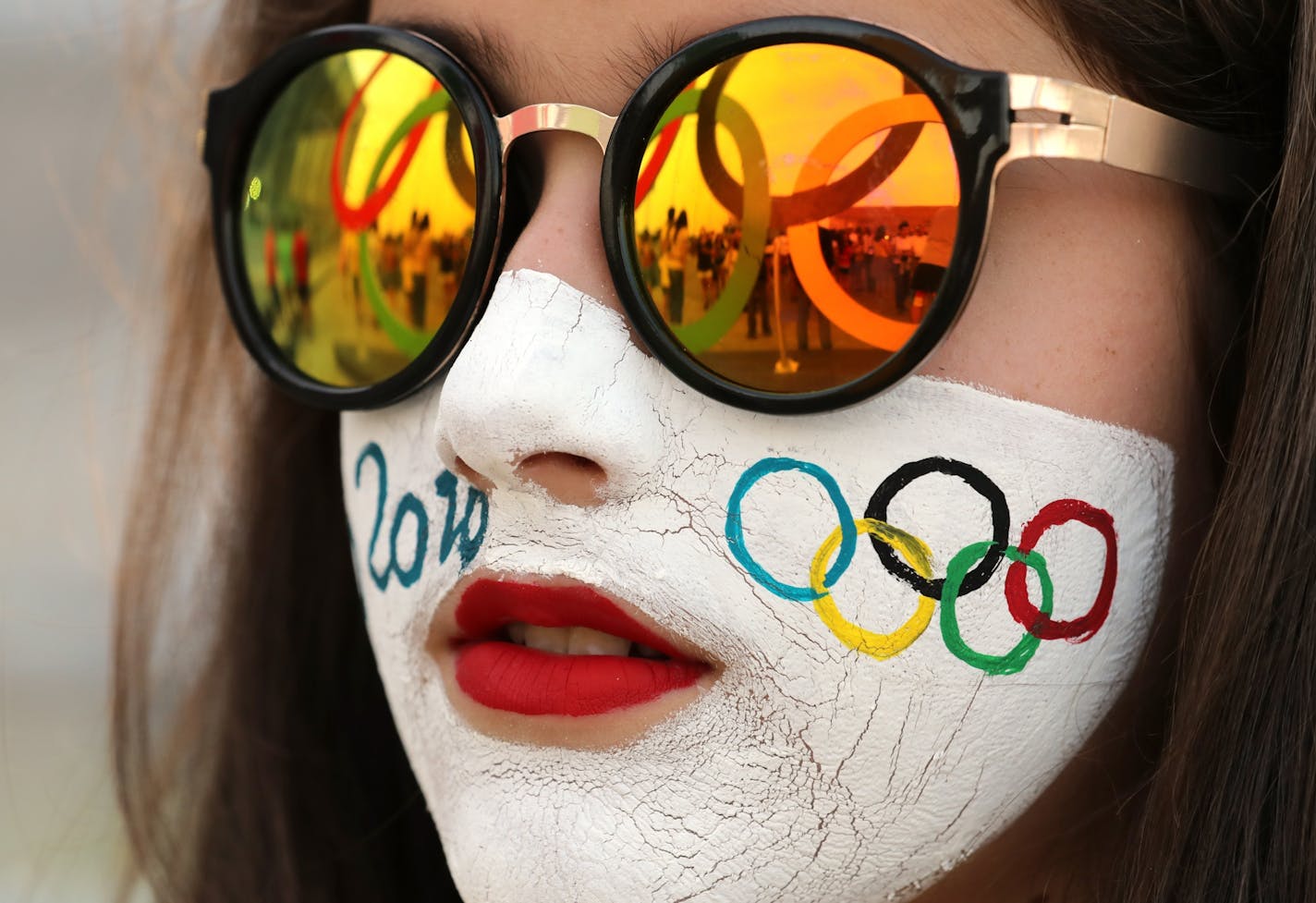 Olympic Park was hopping with Olympic fans on the first day of competition. Here, fans waited in a long line to get their pictures taken with the Olympic rings as the sun set in Rio.