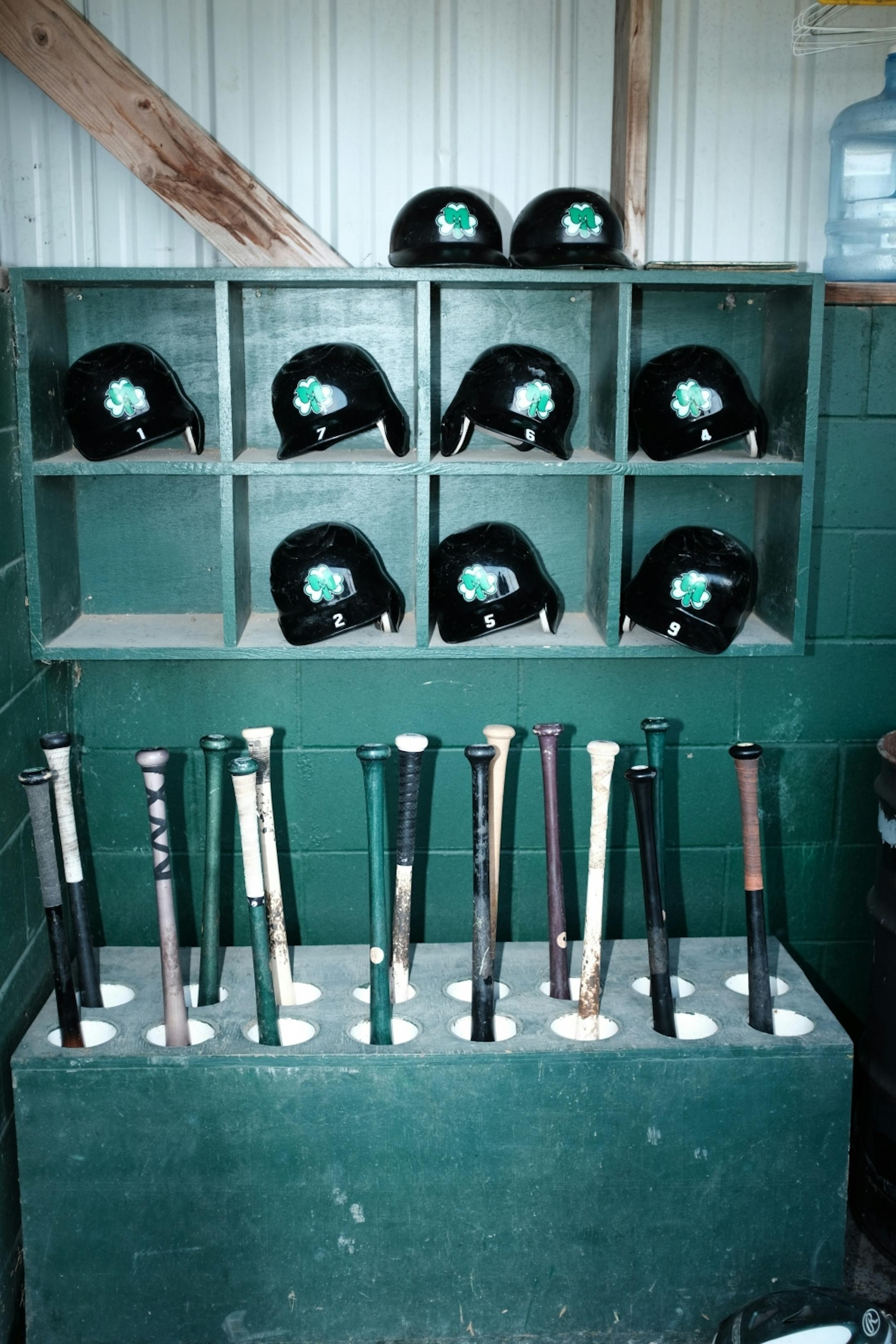 Helmets and bats await players in the Irish dugout.