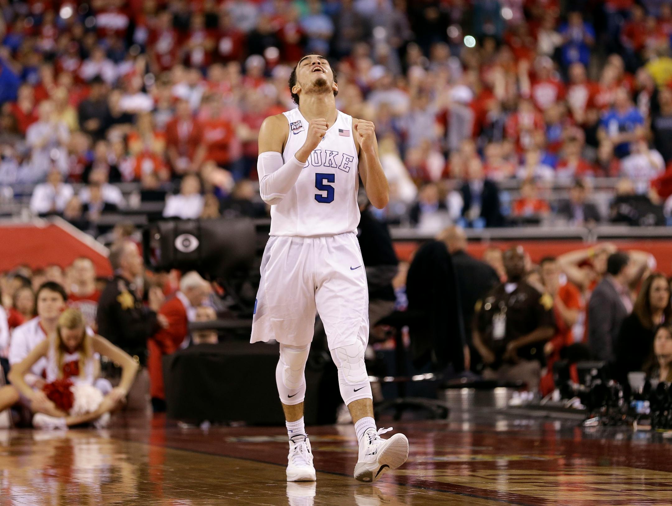 Duke's Tyus Jones reacts during the second half of the NCAA Final Four college basketball tournament championship game against Wisconsin Monday, April 6, 2015, in Indianapolis. Duke won 68-63. (AP Photo/David J. Phillip)