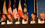 Trade ministers of the United States and 11 other Pacific Rim countries attend a press conference after negotiating the Trans-Pacific Partnership (TPP