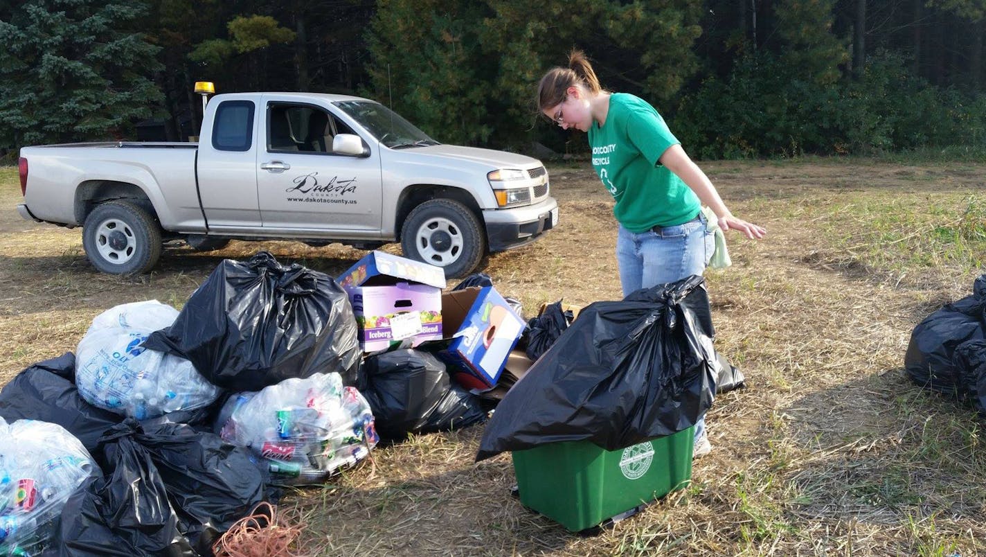 Dakota County&#xed;s Master Recycler/Composter program. Melinda Kawalek weighs materials after an event.