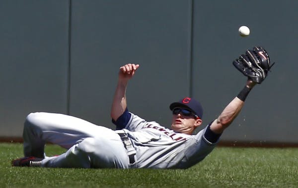 Drew Stubbs dove for a fly ball against the Twins in 2013 when he played for Cleveland.