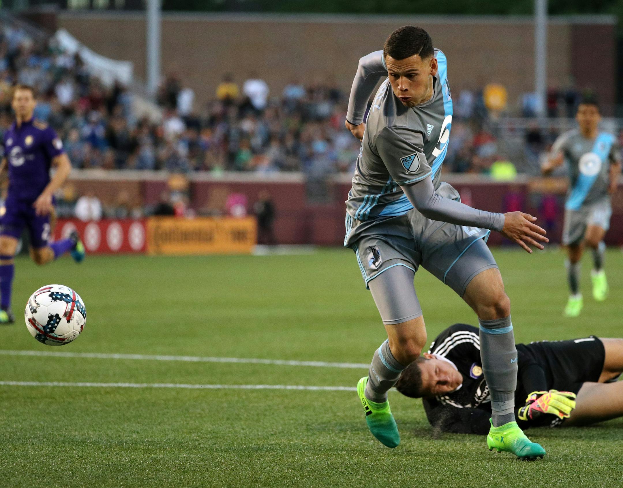 Minnesota United forward Christian Ramirez (21) took the ball around Orlando City SC goalkeeper Joseph Bendik (1) after colliding with him to score Minnesota United's only goal of the game in the second half. ] ANTHONY SOUFFLE ï anthony.souffle@startribune.com Game action from an MLS game between the Minnesota United and the Orlando City SC Saturday, May 27, 2017 at TCF Bank Stadium in Minneapolis.