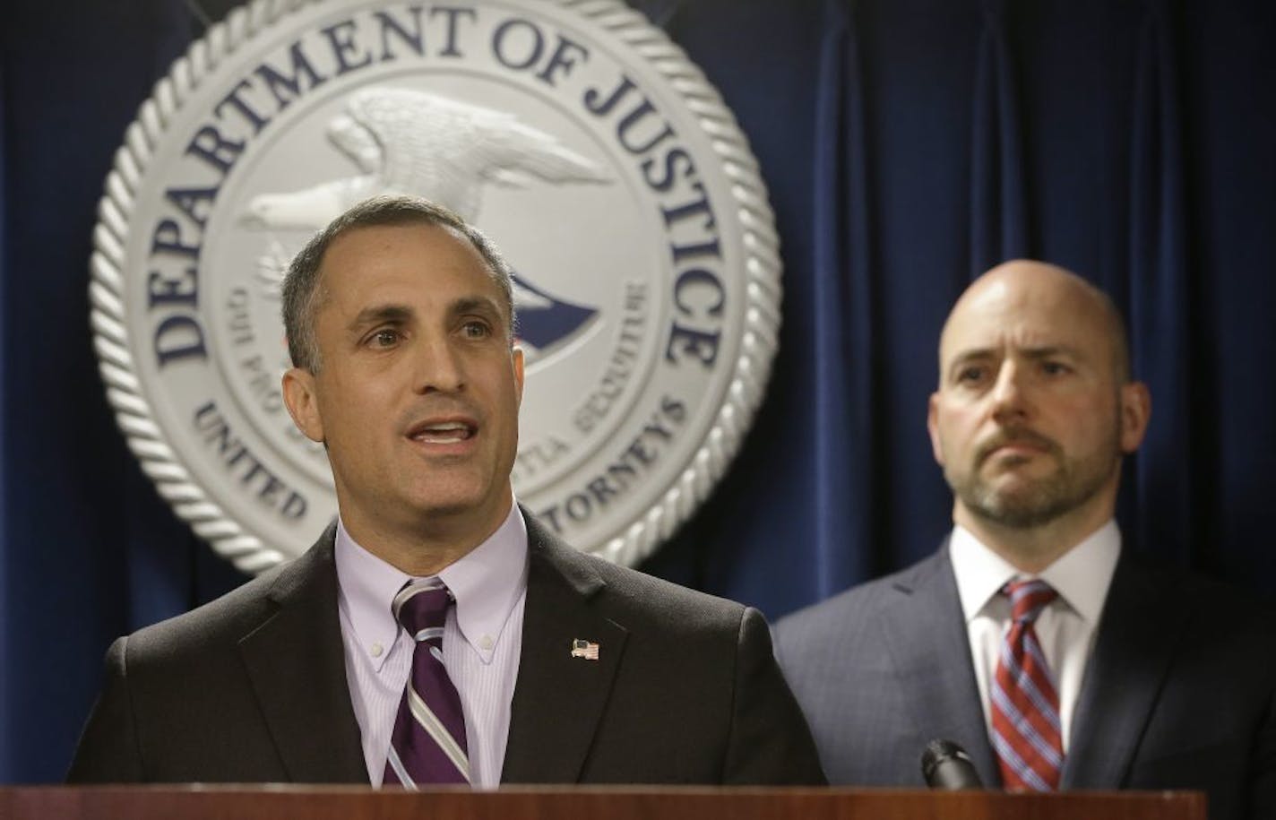 FBI Special Agent in Charge Boston Division Joseph Bonavolonta, left, and U.S. Attorney for District of Massachusetts Andrew Lelling, right, face reporters as they announce indictments in a sweeping college admissions bribery scandal during a news conference, Tuesday, March 12, 2019, in Boston.