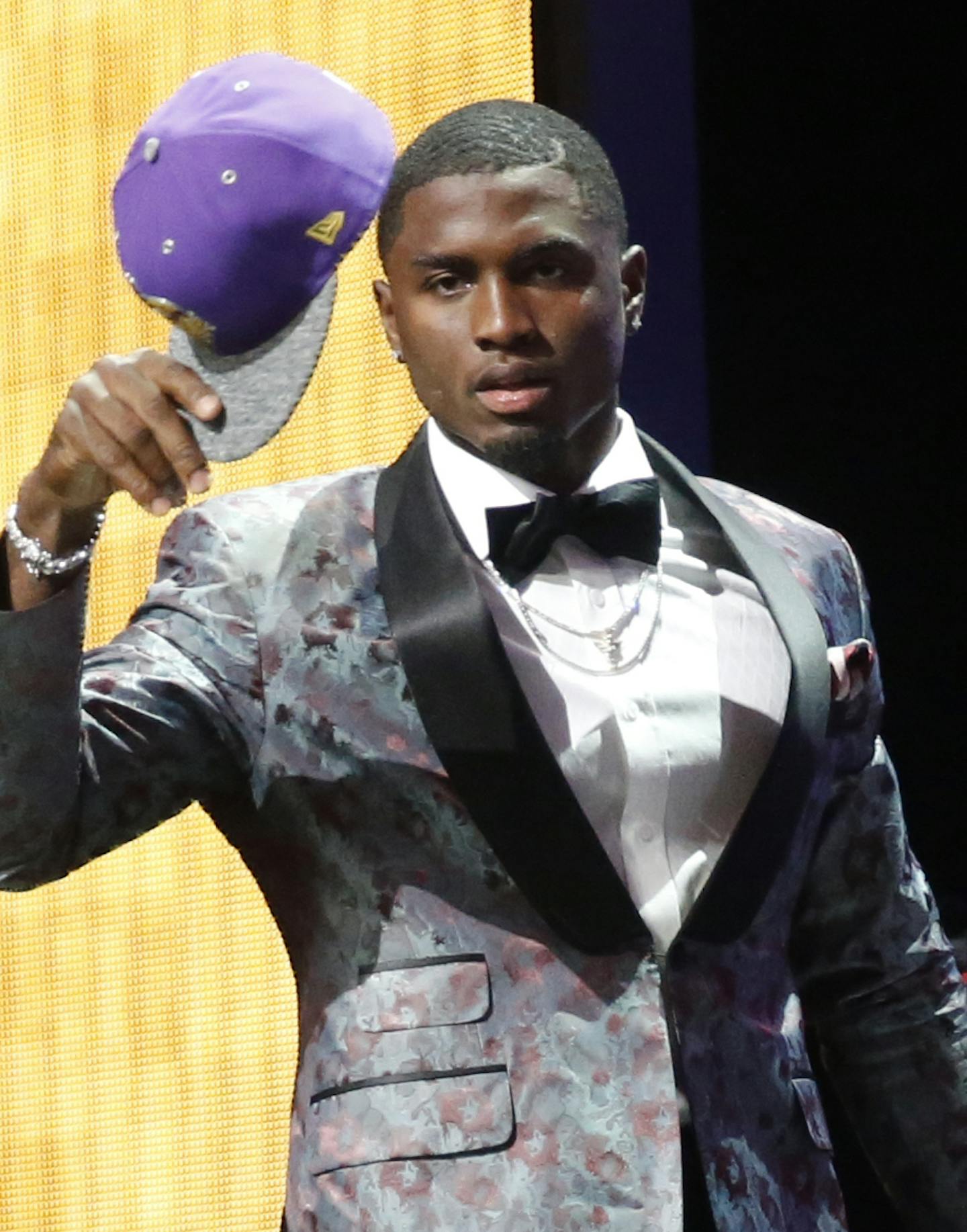 Mississippi&#xed;s Laquon Treadwell walks on the stage with his daughter Madison after being selected by the Minnesota Vikings as the 23rd pick in the first round of the 2016 NFL football draft, Thursday, April 28, 2016, in Chicago. (AP Photo/Charles Rex Arbogast)