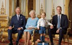 In this image released by the Royal Mail on Wednesday April 20, 2016, Britain's Prince George stands on foam blocks during a photo shoot for the Royal