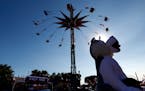 Christian Olheiser, 17, of Rochester carried a large stuffed animal through the Midway at the Minnesota State Fair on Wednesday. ] CARLOS GONZALEZ cgo