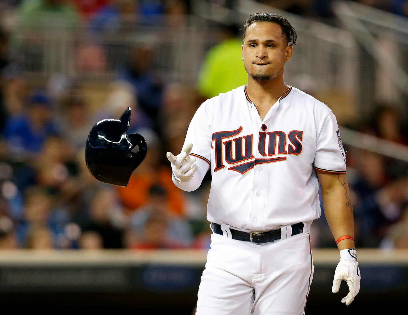 Oswaldo Arcia tossed his helmet after striking out in the seventh inning during a game in May. The Twins designated Arcia for assignment following Thursday's game.