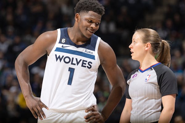 Anthony Edwards of the Wolves chatted with referee Dannica Mosher during Monday’s victory over the Nuggets at Target Center. Edwards asked LGBTQ fan