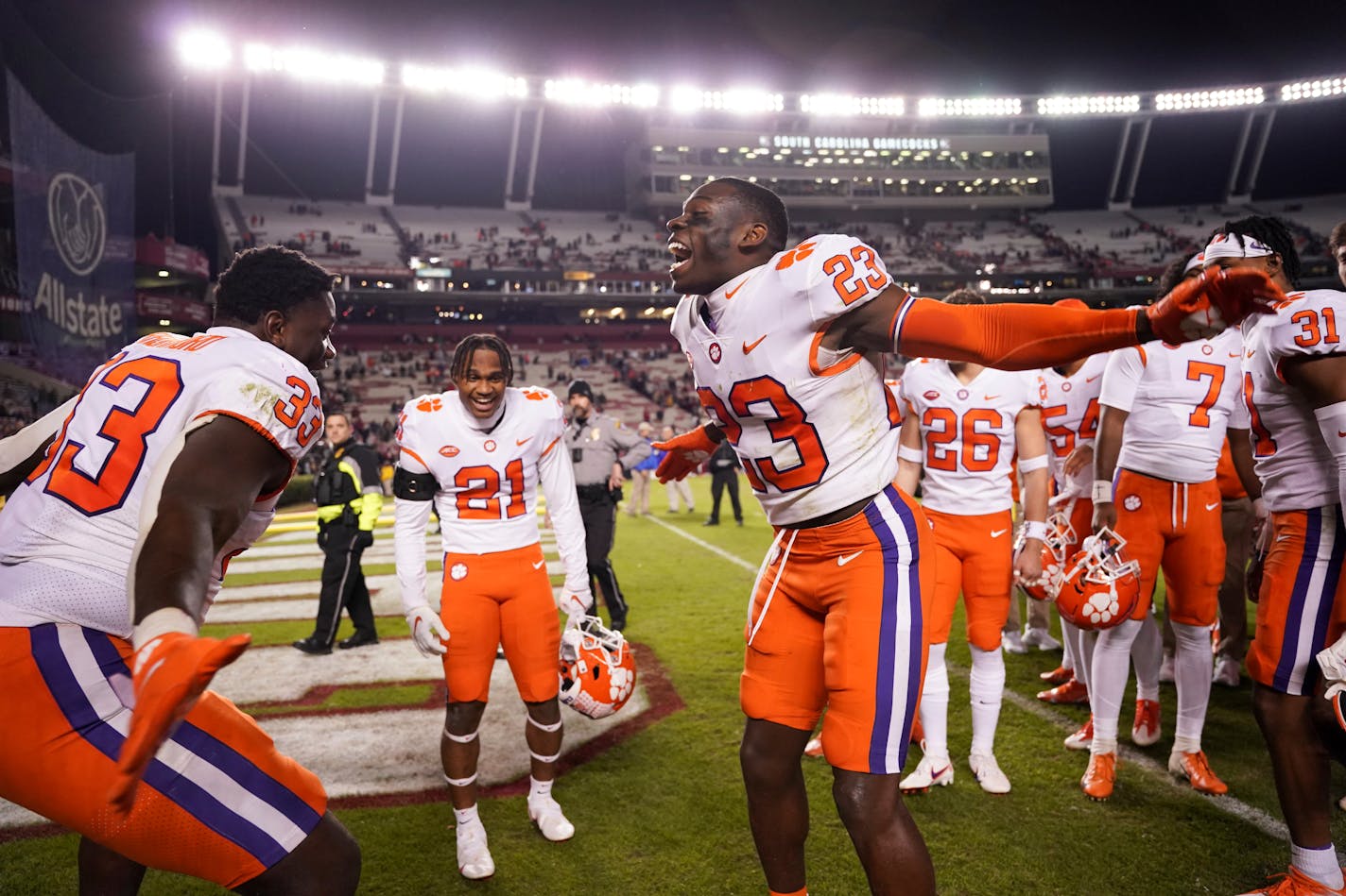 Clemson cornerback Andrew Booth Jr. (23) celebrates with defensive tackle Ruke Orhorhoro (33) after the team's NCAA college football game against South Carolina on Saturday, Nov. 27, 2021, in Columbia, S.C. Clemson won 30-0. (AP Photo/Sean Rayford)