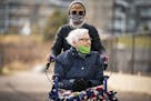 Lynda Lange took her mother MaryAnn Falk, 85, out for a walk around the McKenna Crossing Assisted Living facility in Prior Lake.