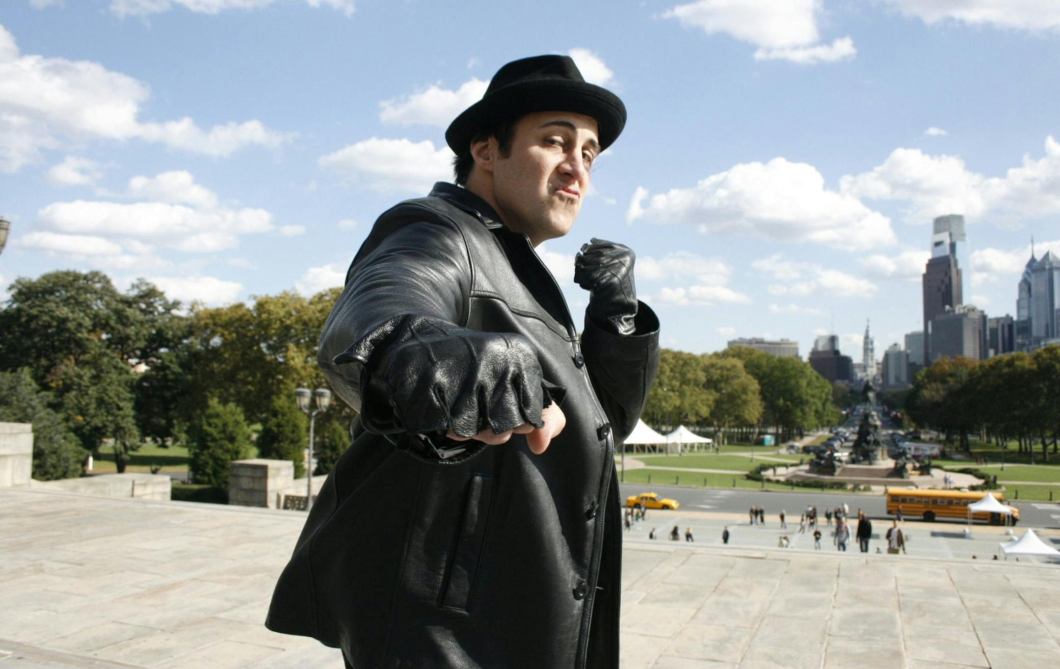 In this September 2011 file photograph, Rocky Balboa impersonator Mike Kunda atop the Art Museum steps in Philadelphia. "The steps are a symbol of hope and inspiration," he said. "Even though it's corny, it is what it is." (Ashlee Espinal/Philadelphia Inquirer/MCT) ORG XMIT: 1155244