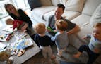 Brynn Randall and her fiance, Charlie Whitmer, play with bubbles along with their children at their home in Chicago. ORG XMIT: 1610161