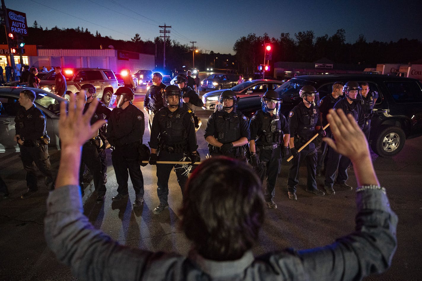 A protestor confronted riot police on Central Ave after they made an arrest during the protest in Duluth, MN on Saturday. ] ALEX KORMANN • alex.kormann@startribune.com Over a thousand people marched through the streets of Duluth, MN on May 30, 2020 to protest the death of George Floyd.