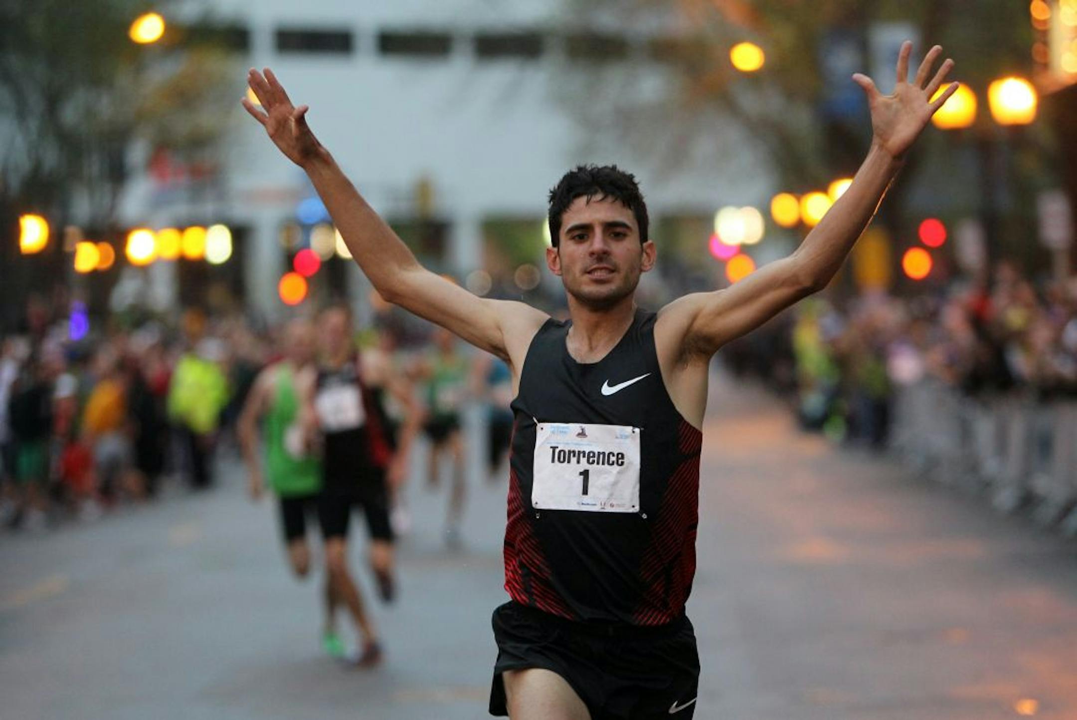 David Torrence crossed the finish line to win his third consecutive USA 1-Mile Road Championship on Thursday in downtown Minneapolis.