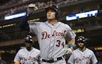 Detroit Tigers' James McCann celebrates his three-run home run off Minnesota Twins pitcher Hector Santiago in the sixth inning of a baseball game Tues